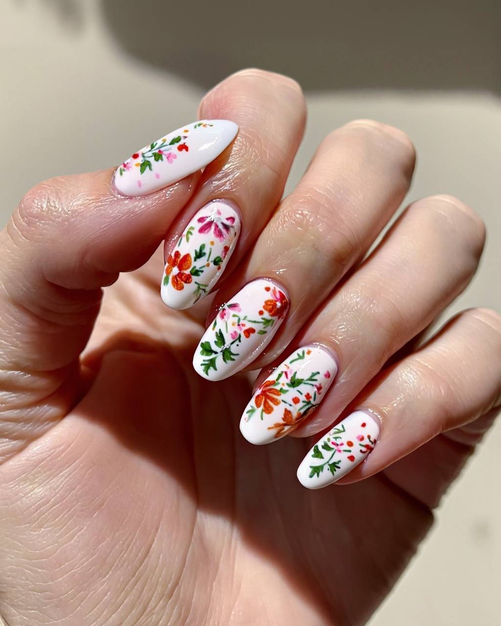Squoval floral nail design by Mae Sullivan
