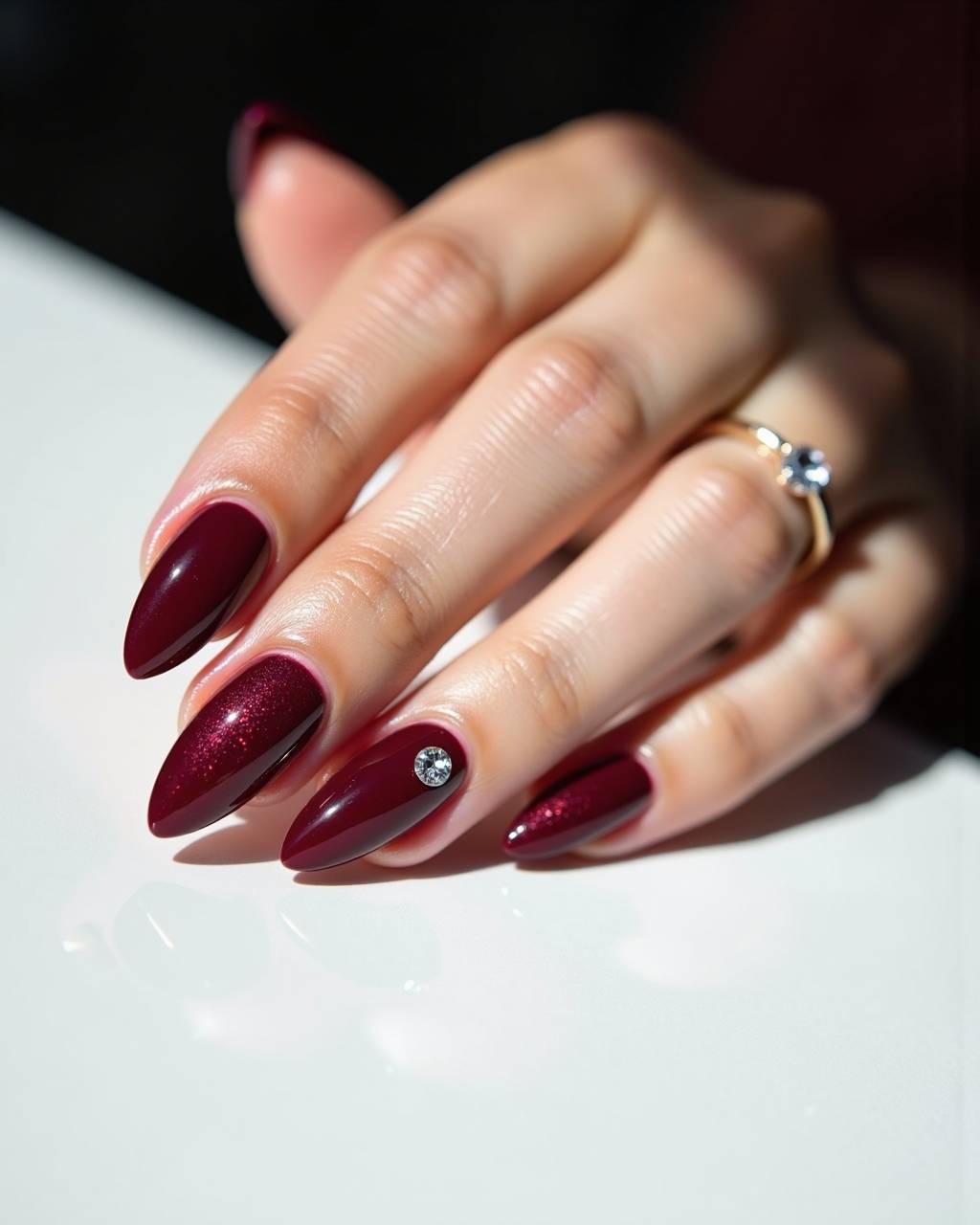 Almond rhinestone nail design by Sofia Russo