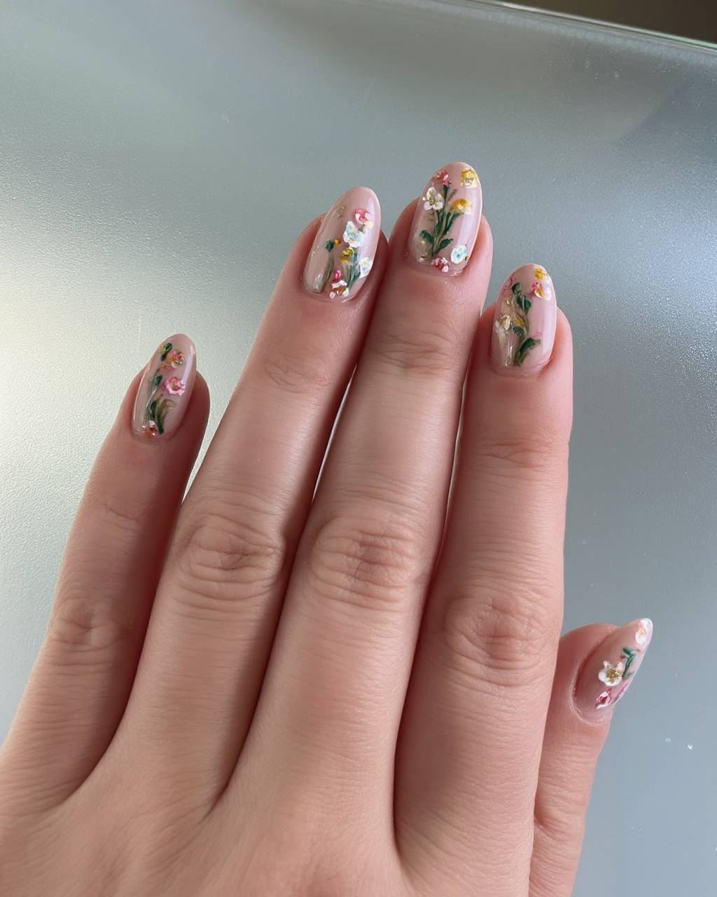 Oval floral nail design by Sofia Russo