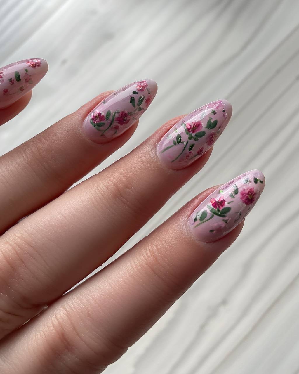 Stiletto floral nail design by Noor Haddad