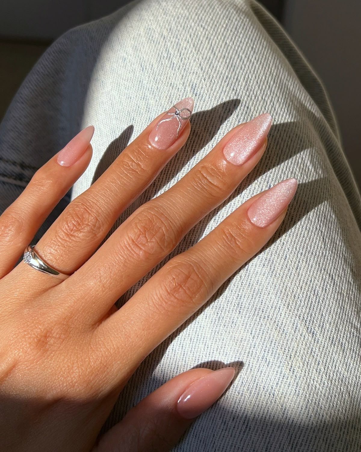 Squoval floral nail design by Mia Alvarez