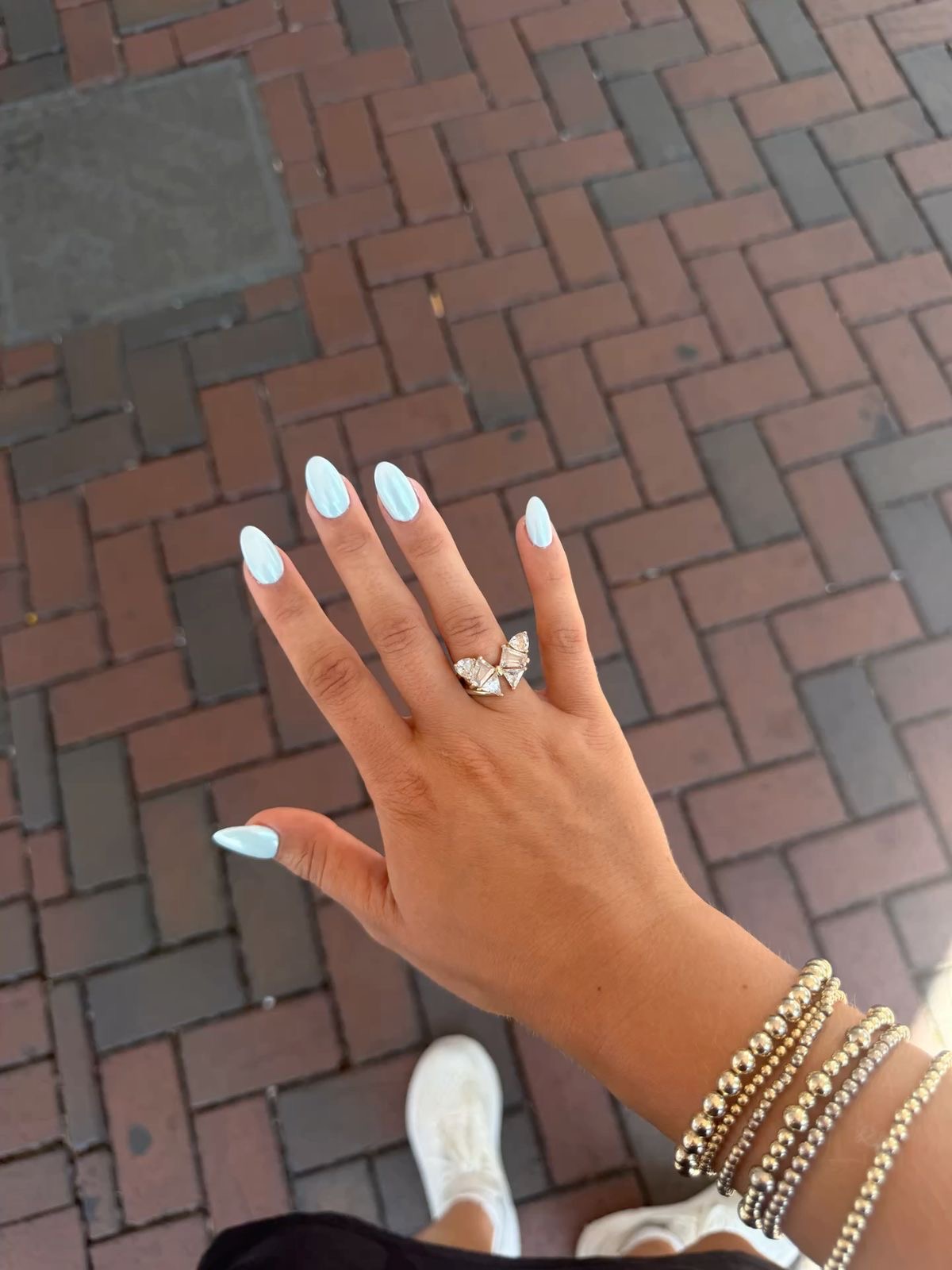 Almond rhinestone nail design by Sadie Bloom