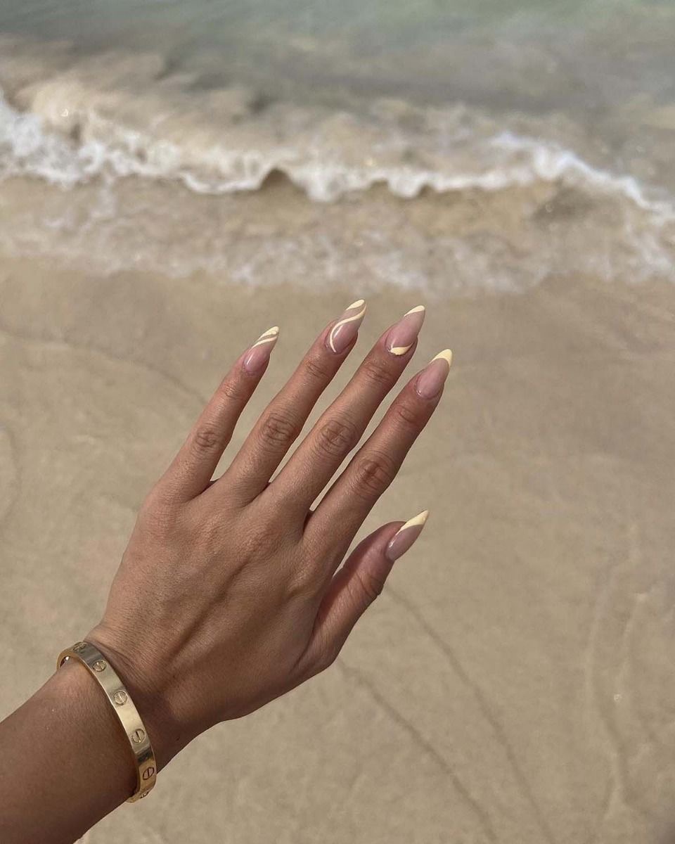 Almond chrome French nail design by Nina Patel